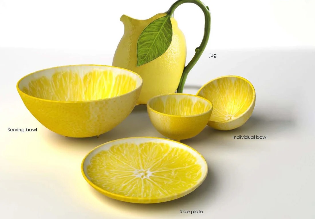 Service de table Bordallo Pinheiro en céramique représentant un citron, avec pichet, bols, saladier et assiette aux détails réalistes inspirés de la nature.